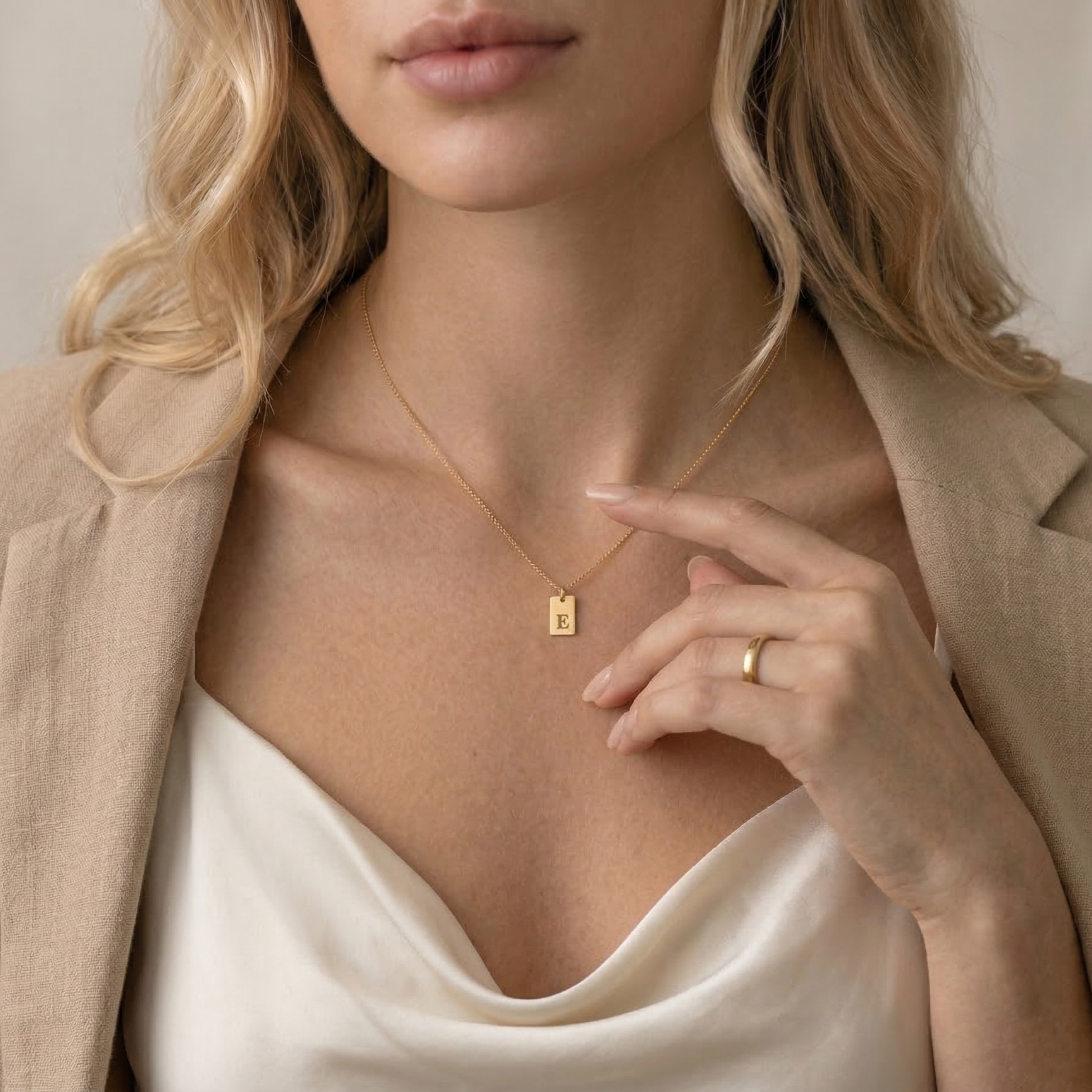 Woman wearing gold initial tag necklace - Calioras