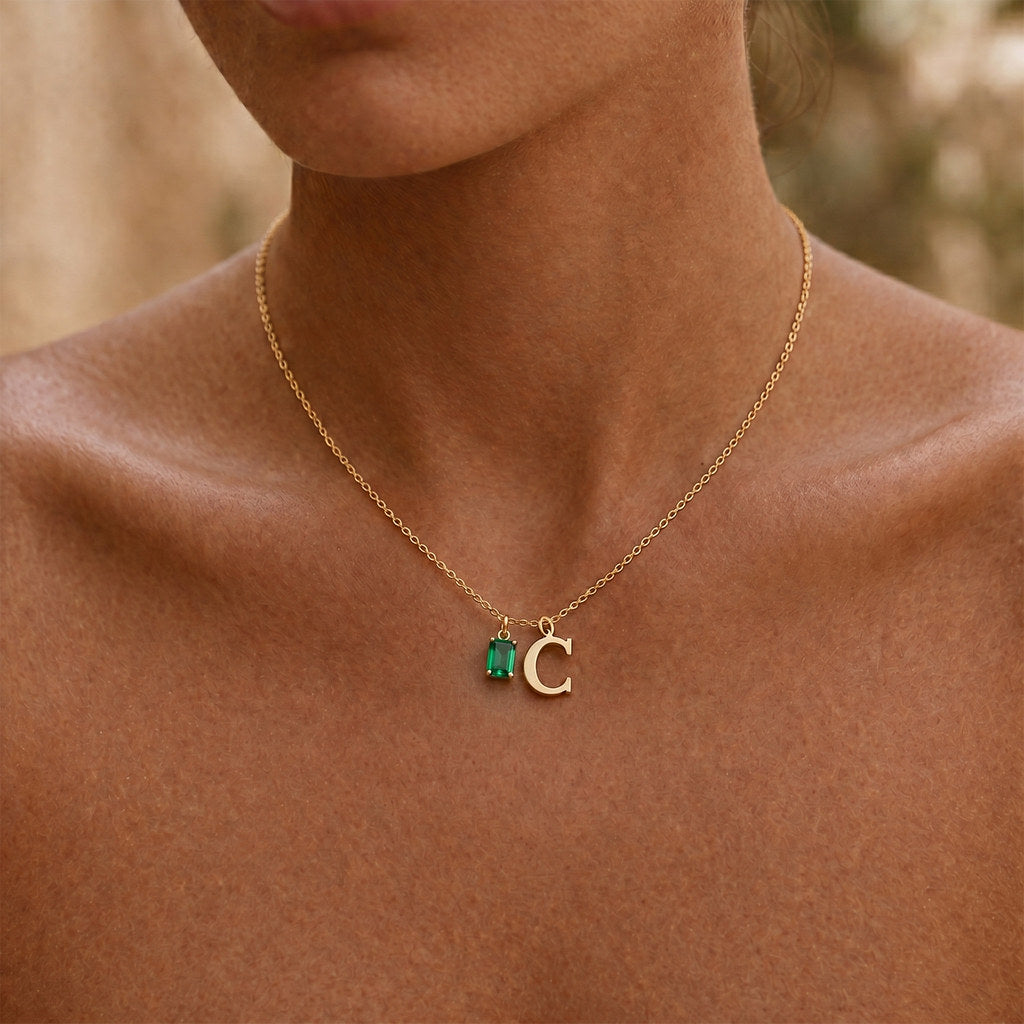 Woman wearing gold rectangle birthstone necklace - Calioras
