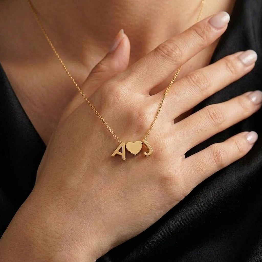Woman wearing gold heart initial necklace - Calioras

