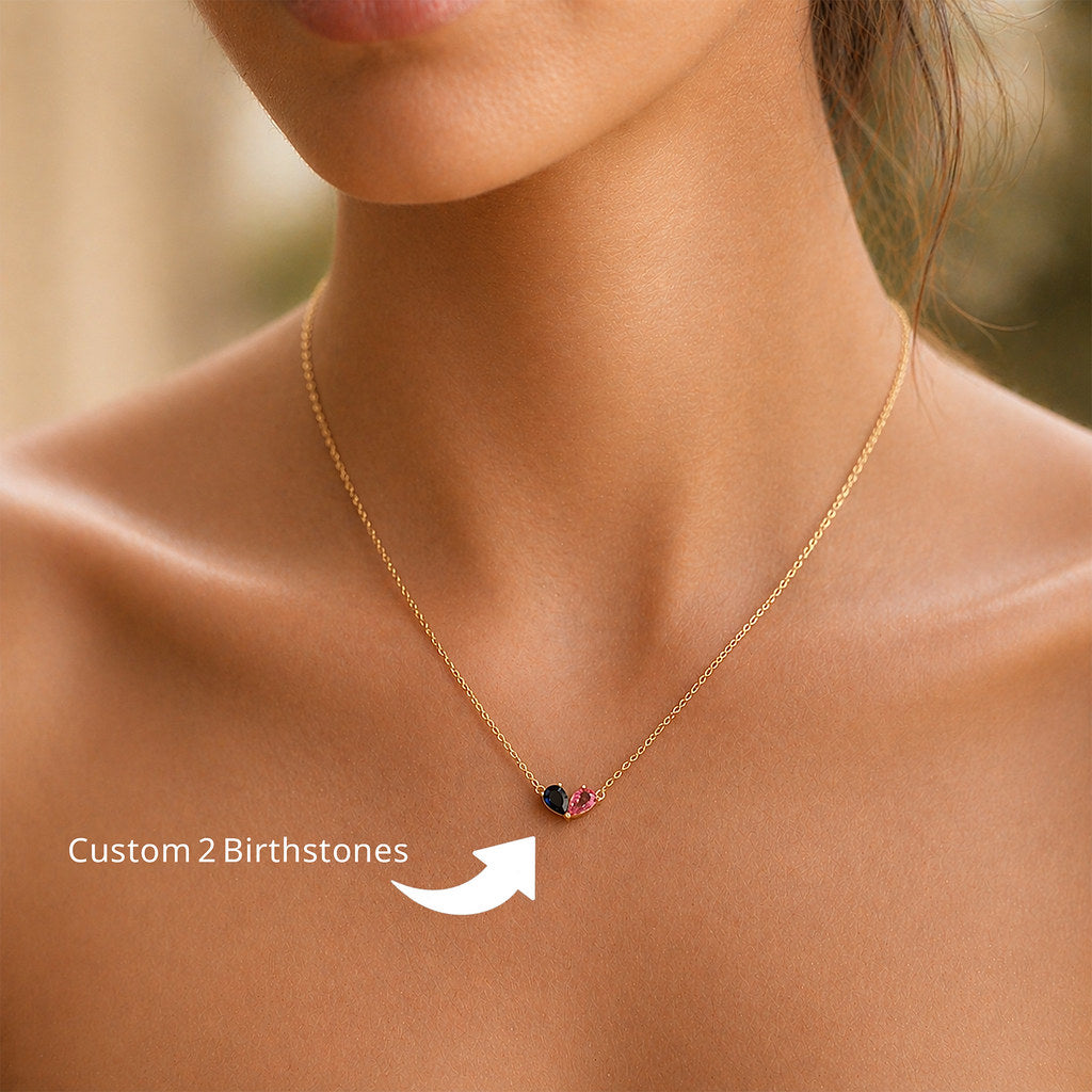 Woman wearing gold heart birthstone necklace - Calioras