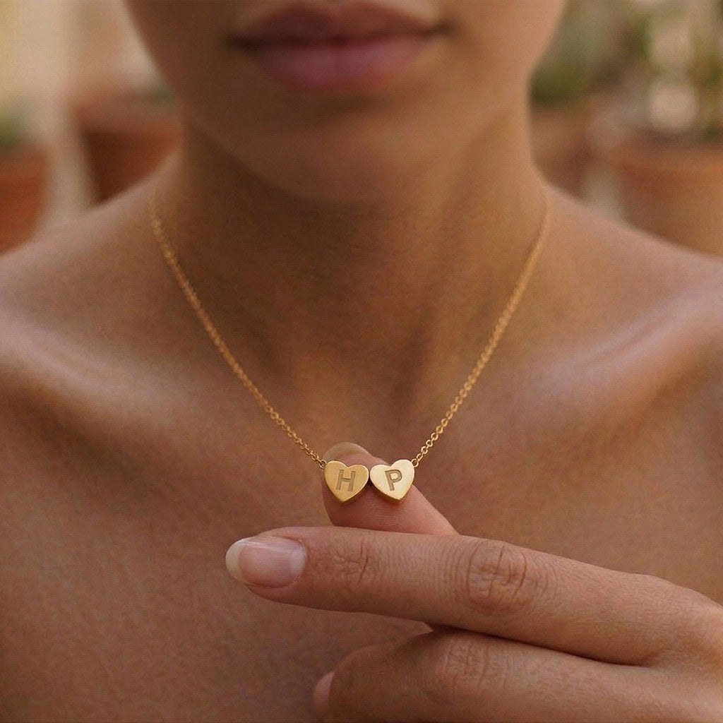 Close-up of 3D heart charm with initial in gold - Calioras
