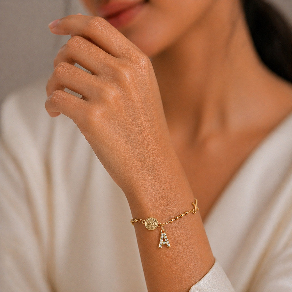 Woman wearing gold Virgin Mary cross bracelet - Calioras