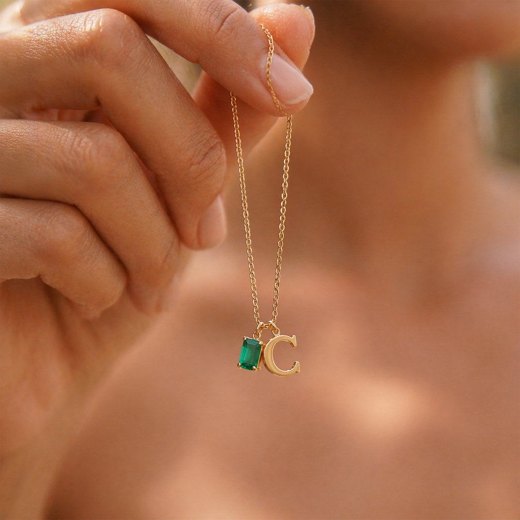 Close-up of rectangle pendant with birthstone and initial - Calioras
