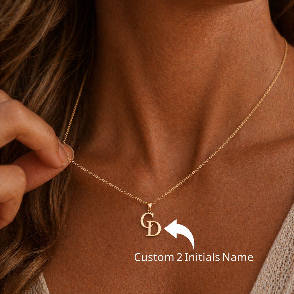 Woman wearing gold couple initial necklace - Calioras