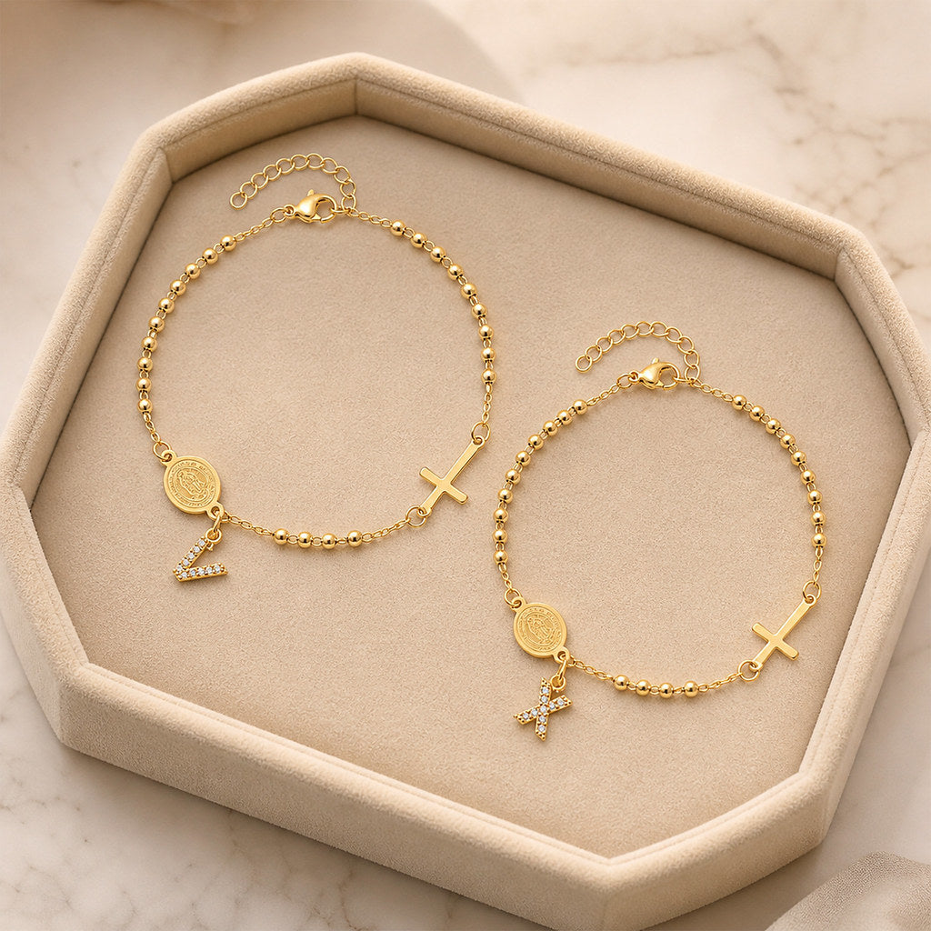 Close-up of Virgin Mary and cross charm in gold - Calioras