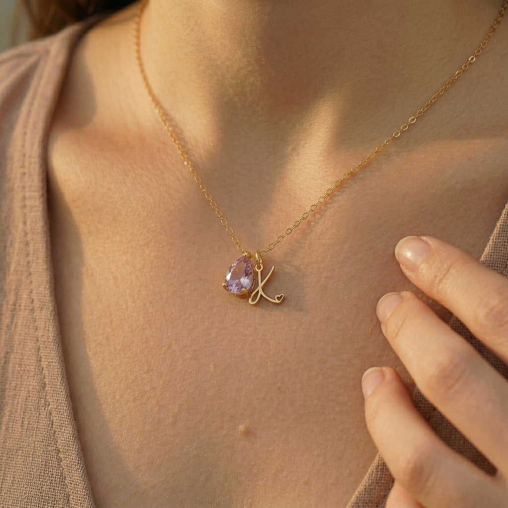 Woman wearing gold teardrop birthstone necklace - Calioras

