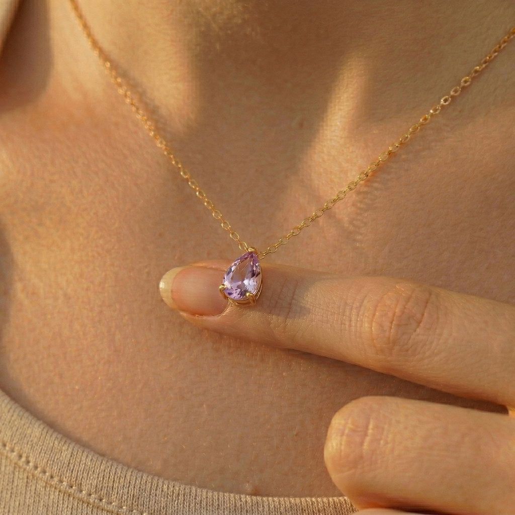 Close-up of teardrop pendant with birthstone - Calioras
