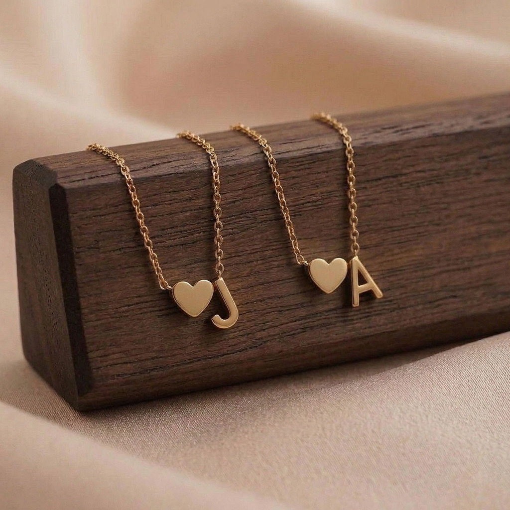 Close-up of dainty heart pendant with initial - Calioras
