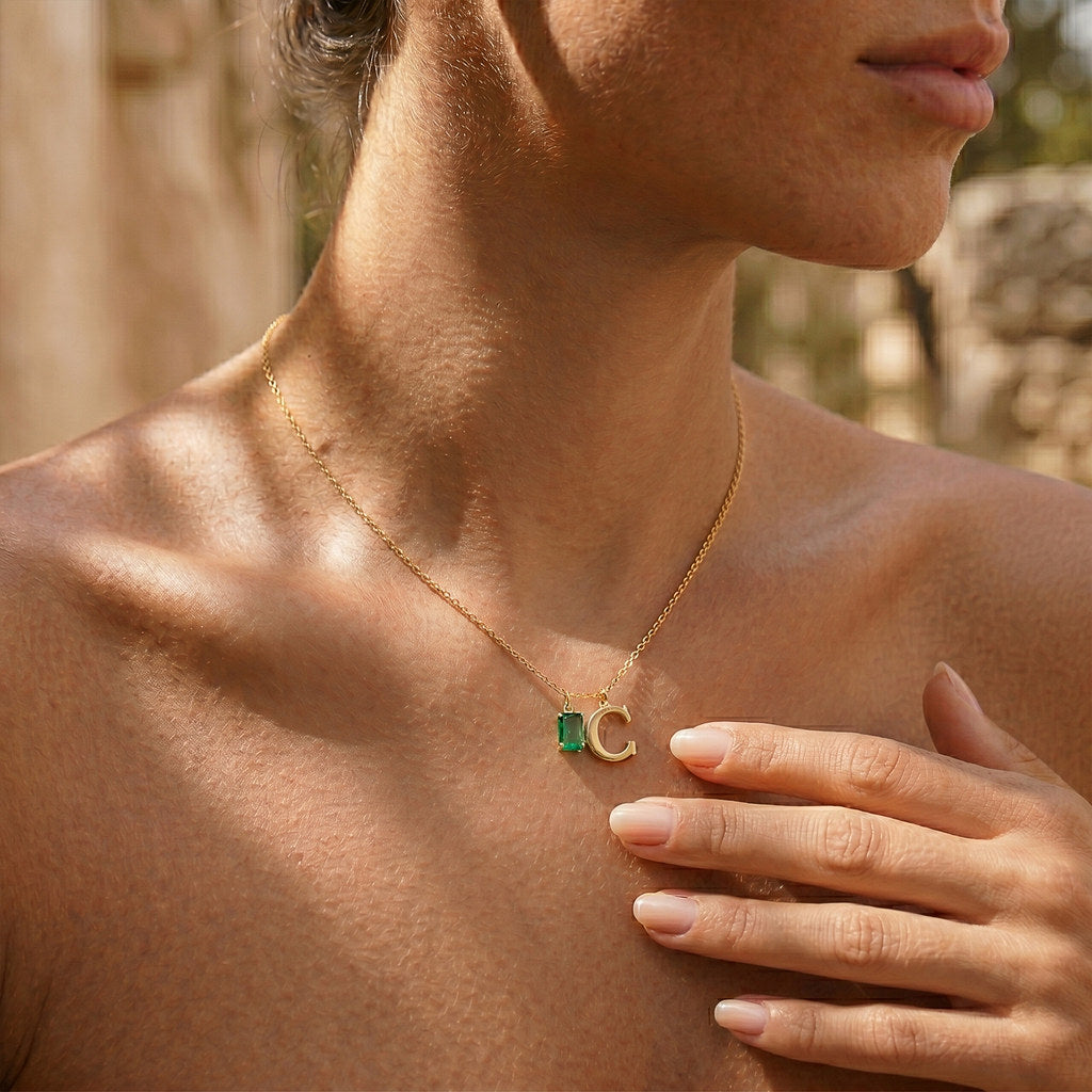 Woman wearing gold rectangle birthstone necklace - Calioras
