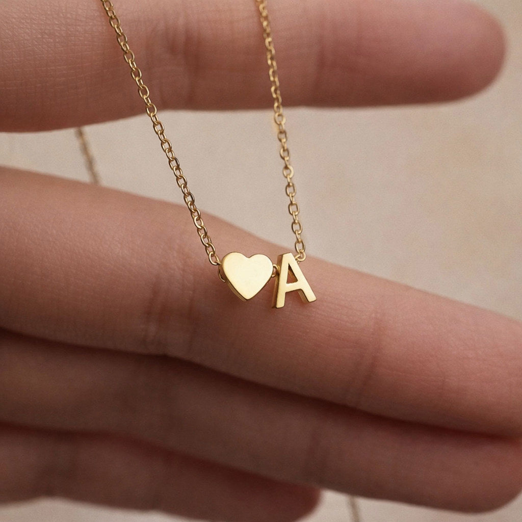 Close-up of dainty heart pendant with initial - Calioras
