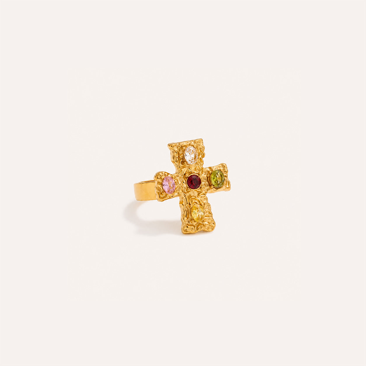 Baroque cross ring in 18K gold with ornate cross on cream background