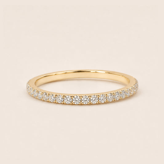 18K gold full pave CZ eternity ring dainty stackable band on cream background