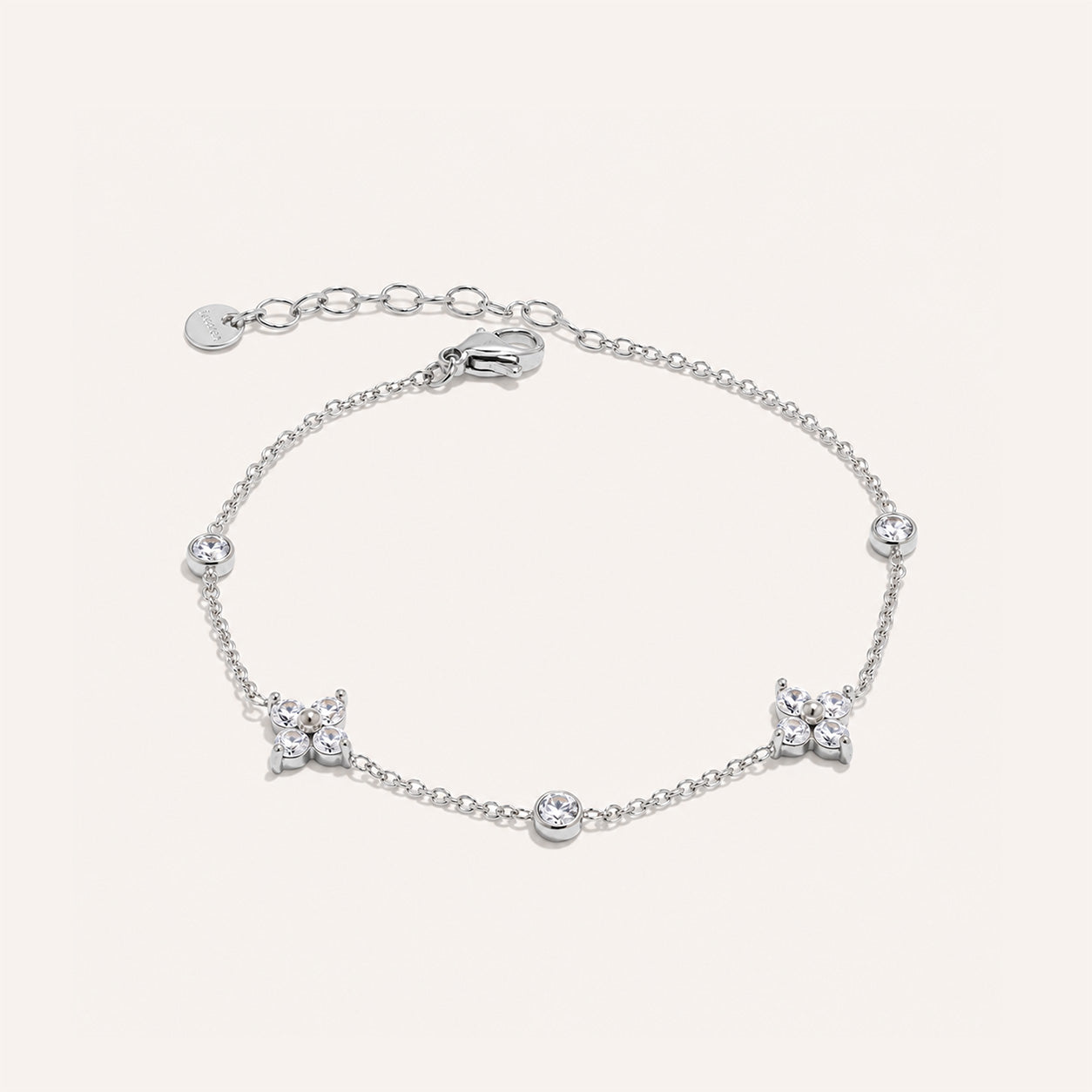 Crystal blossom station bracelet in silver on cream background