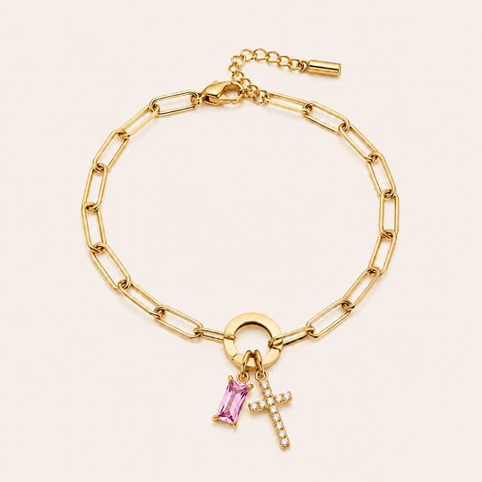 Gold paperclip birthstone cross bracelet with pavé CZ cross charm and pink birthstone