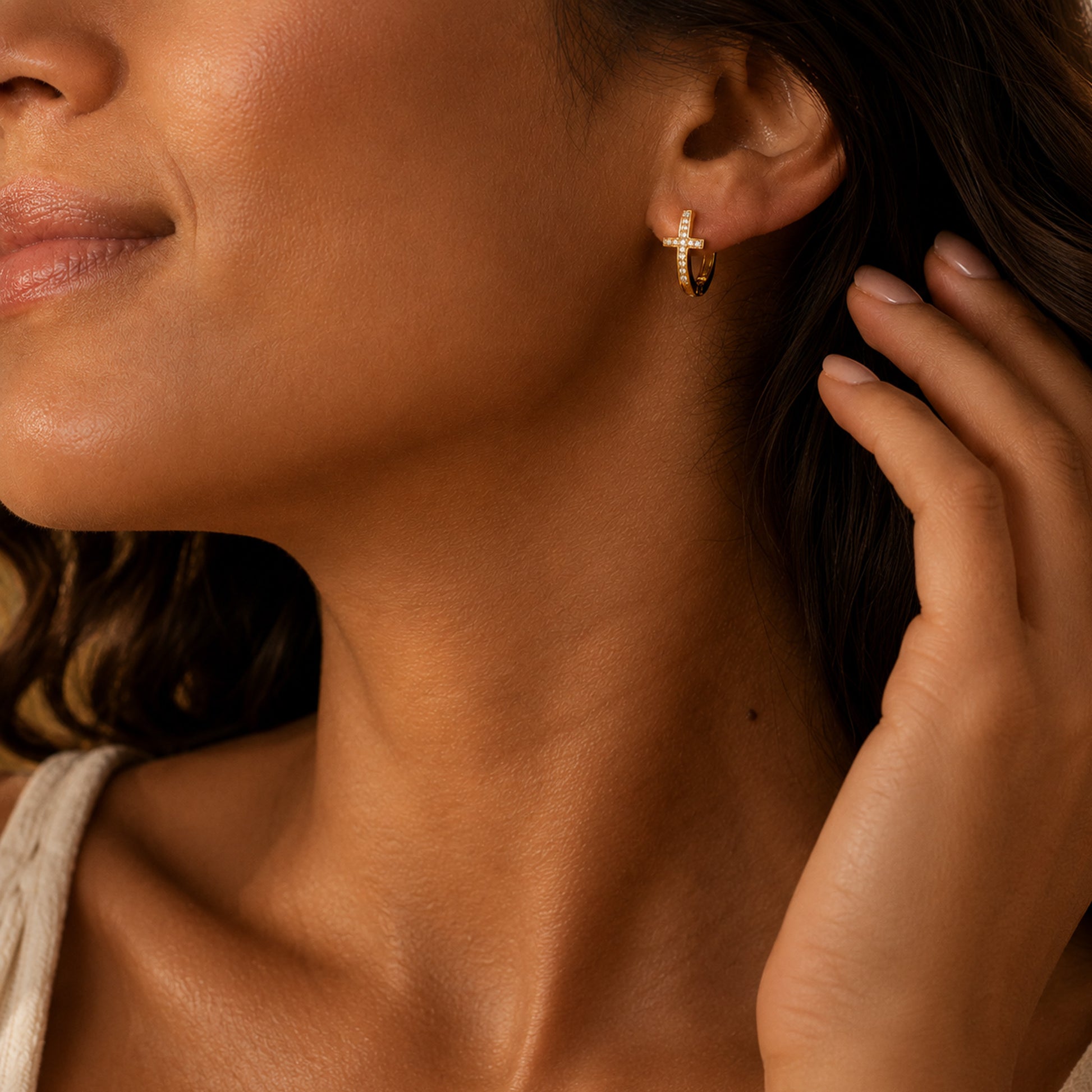 Gold pave cross huggie earrings