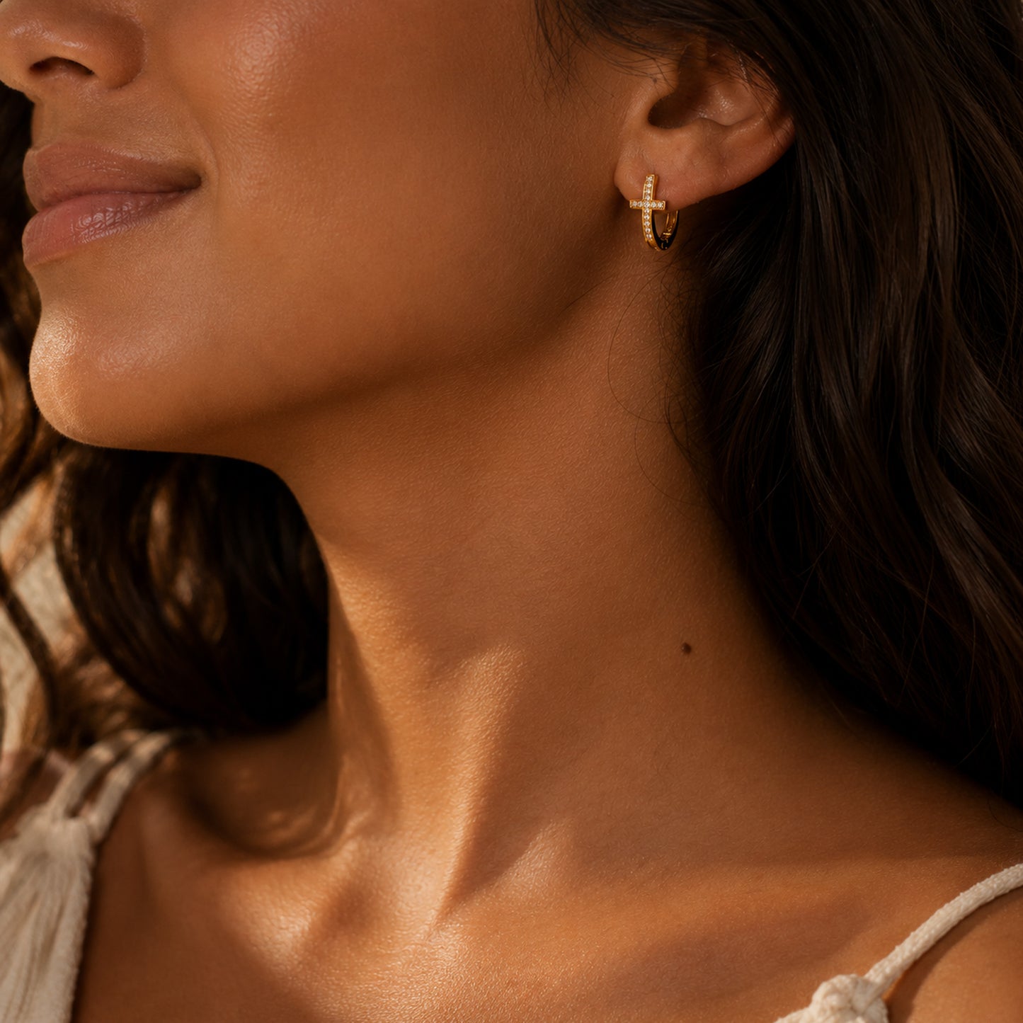 Gold pave cross huggie earrings