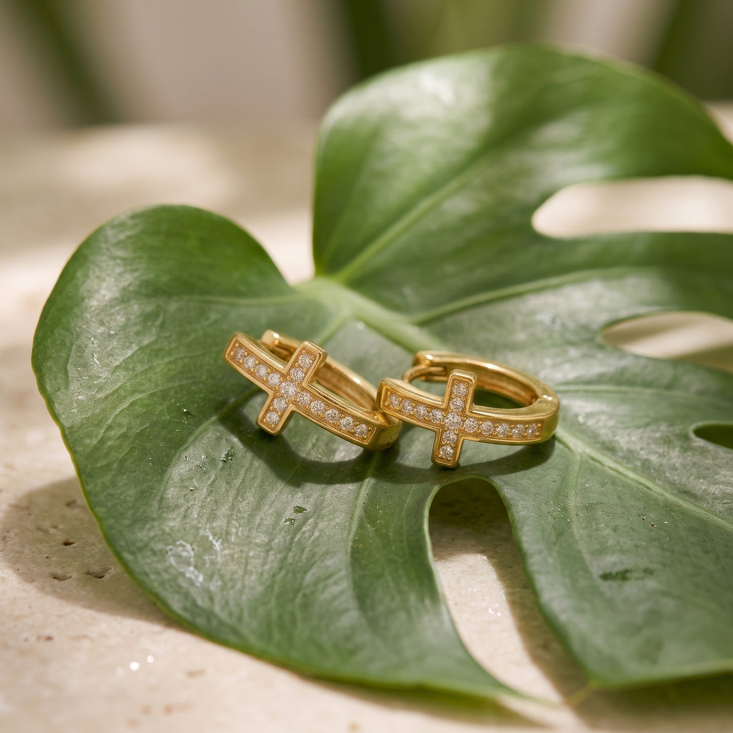 Gold pave cross huggie earrings